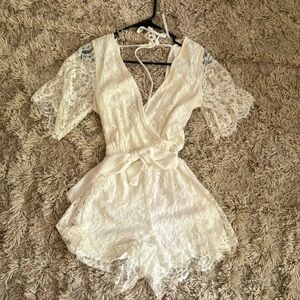 Francesca’s small white romper. New with tags